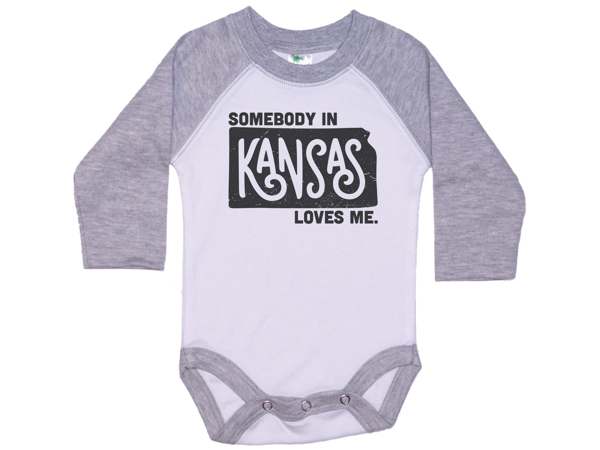 Somebody In Kansas Loves Me Onesie®