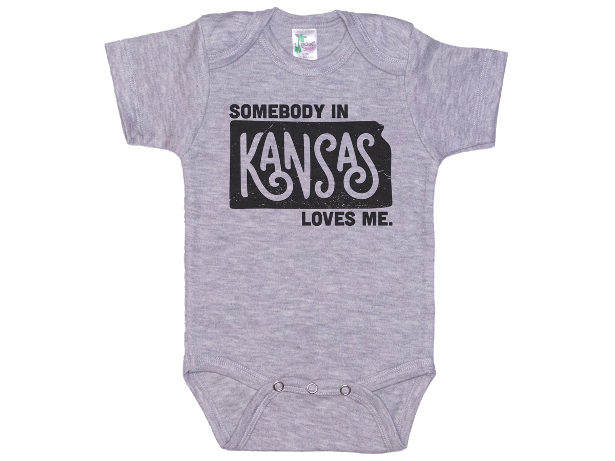 Somebody In Kansas Loves Me Onesie®
